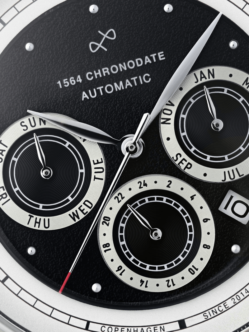 1564 Chronodate Automatic by AV86 vintage-inspired dial with triple subdials, date window, and finely textured black face