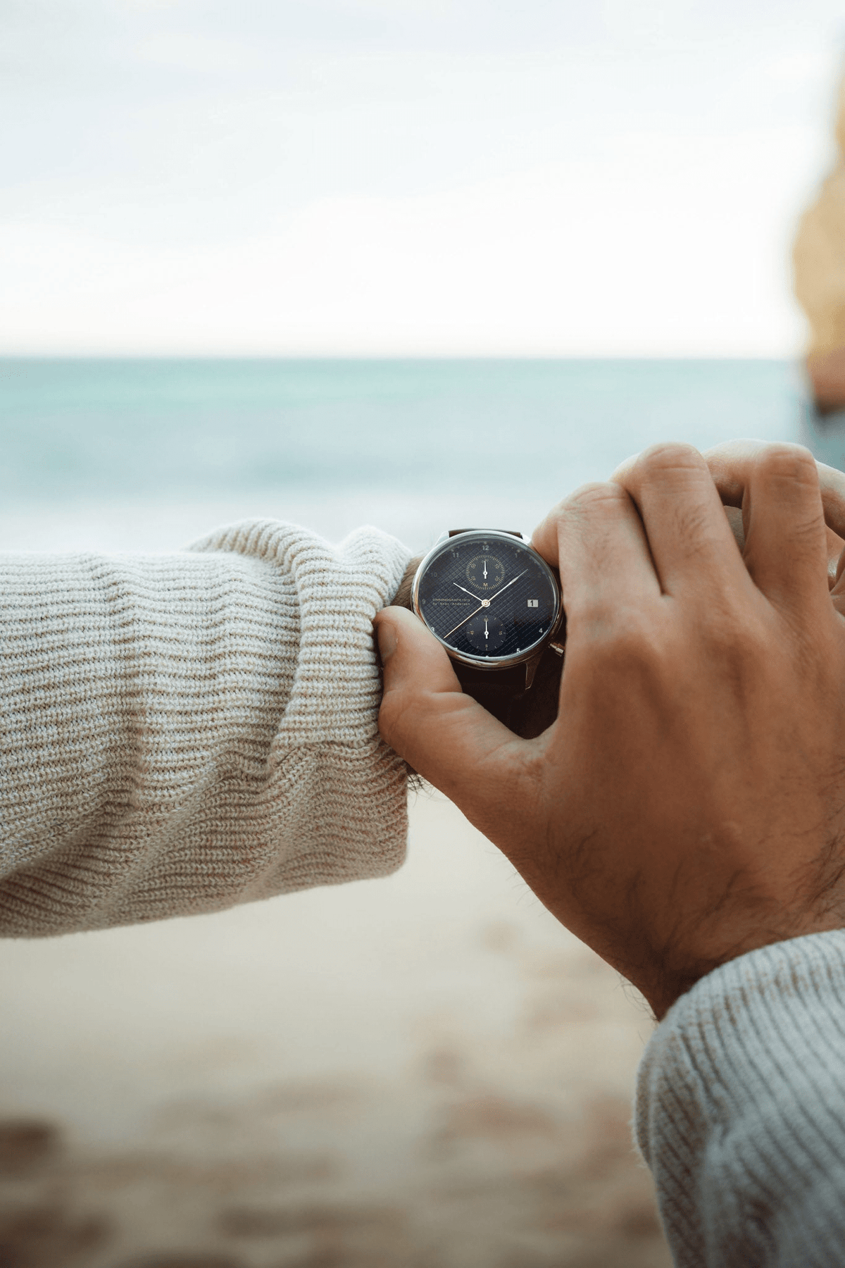 1815 Chronograph by AV86 luxury chronograph with sapphire crystal, textured dial, and black leather strap in casual beach setting