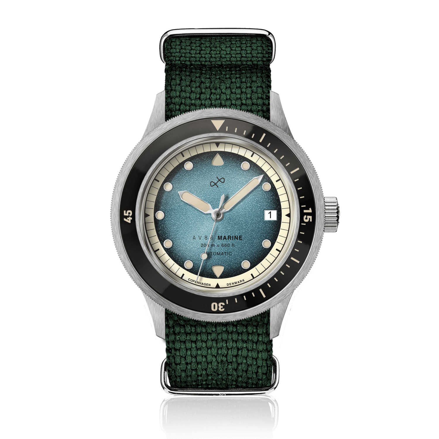 1956 Marine Automatic、スチール/ブルーフェード。ヴィンテージ風のブルーフェード文字盤、ステンレススチール製ケース、AV86製のグリーンファブリックストラップを採用しています。