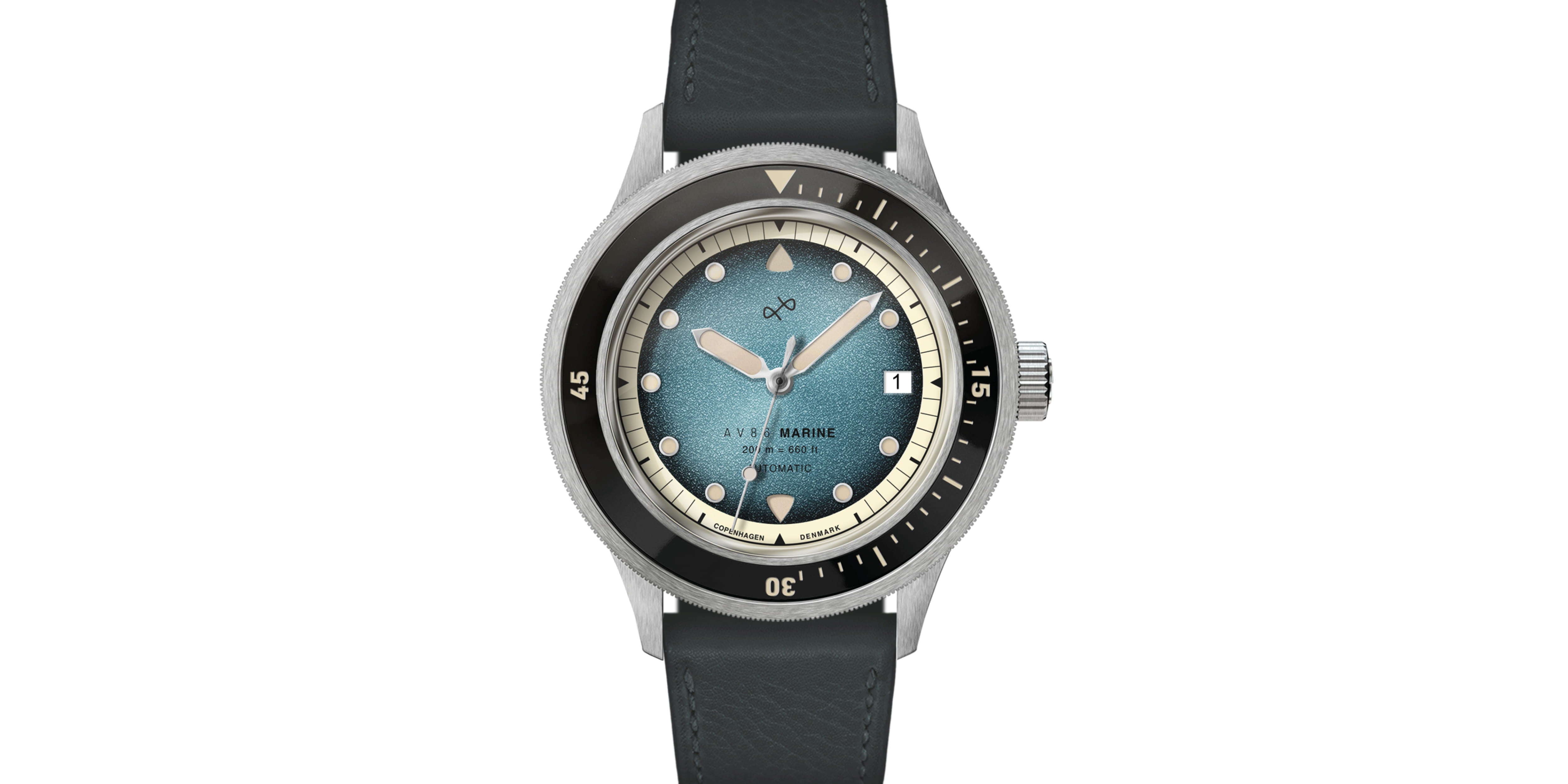 Wristwatch with a textured blue dial, black rotating bezel, and polished steel case paired with a black leather strap.