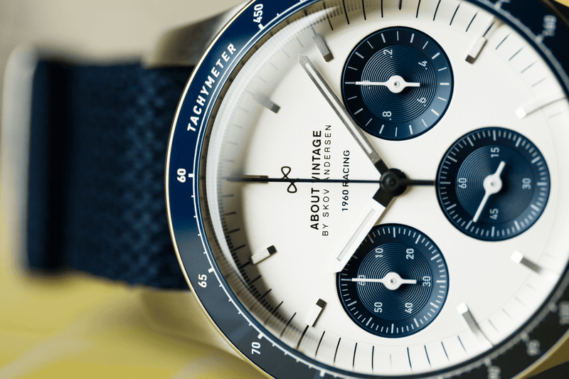 1960 Racing Chronograph by AV86 with vintage-inspired dial, tachymeter bezel, sapphire crystal, and textured navy strap