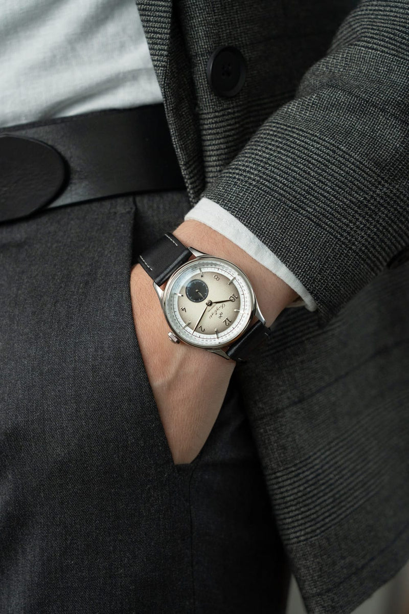 1968 Mechanical (Hand-Wound) by AV86 vintage-inspired dress watch with sapphire crystal and black leather strap on wrist