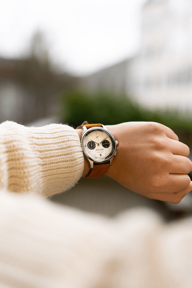 1934 Telechron by AV86 vintage-inspired chronograph with telemeter, sapphire crystal, and brown leather strap on wrist outdoors