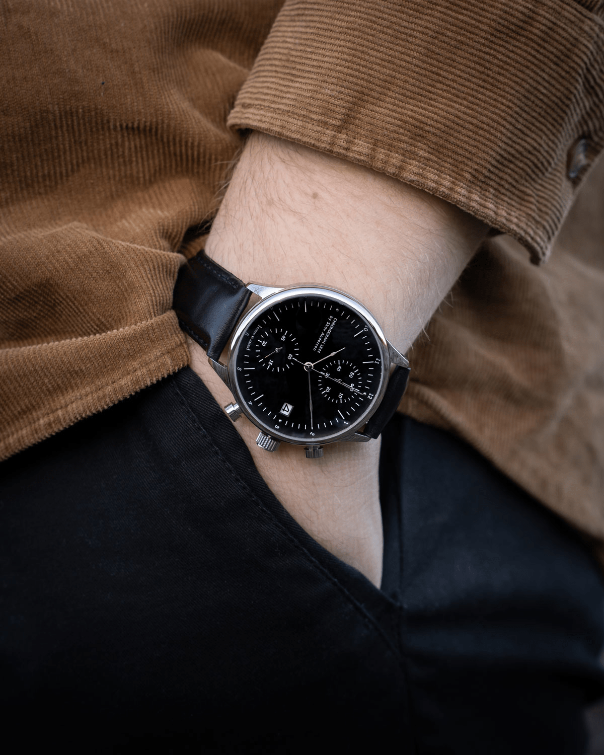 1844 Chronograph by AV86 luxury timepiece with black dial, sapphire crystal, precision subdials, and black leather strap on wrist