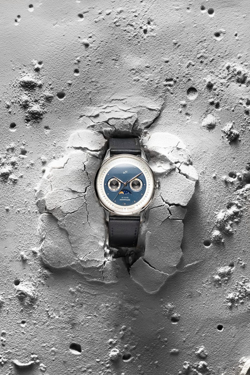 1968 Moonphase by AV86 luxury moonphase watch with sapphire crystal, textured dial, and black leather strap on lunar surface backdrop