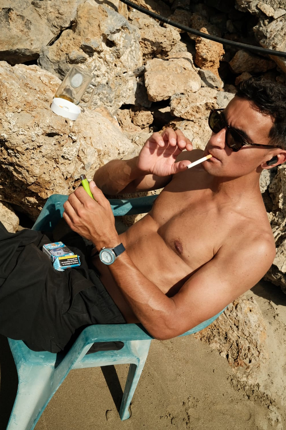 1956 Marine by AV86 vintage-inspired diver watch with sapphire crystal, compass bezel, and rubber strap in relaxed outdoor setting