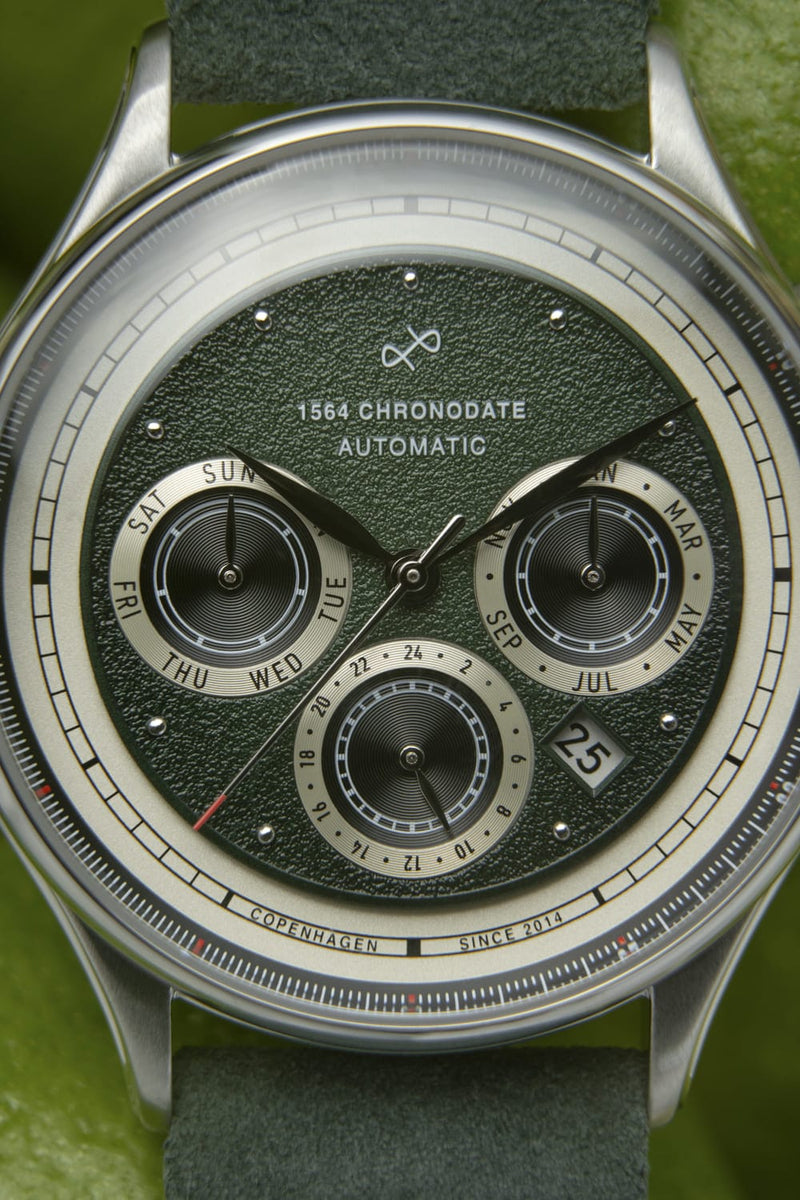 1564 Chronodate Automatic by AV86 with vintage-inspired green textured dial, sapphire crystal, day, month, 24h subdials, leather strap