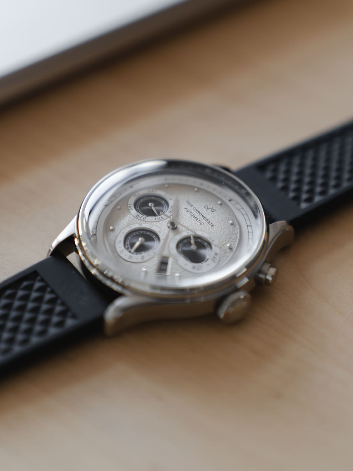 1564 Chronodate Automatic by AV86 with textured dial, automatic chronograph movement, sapphire crystal, and black rubber strap