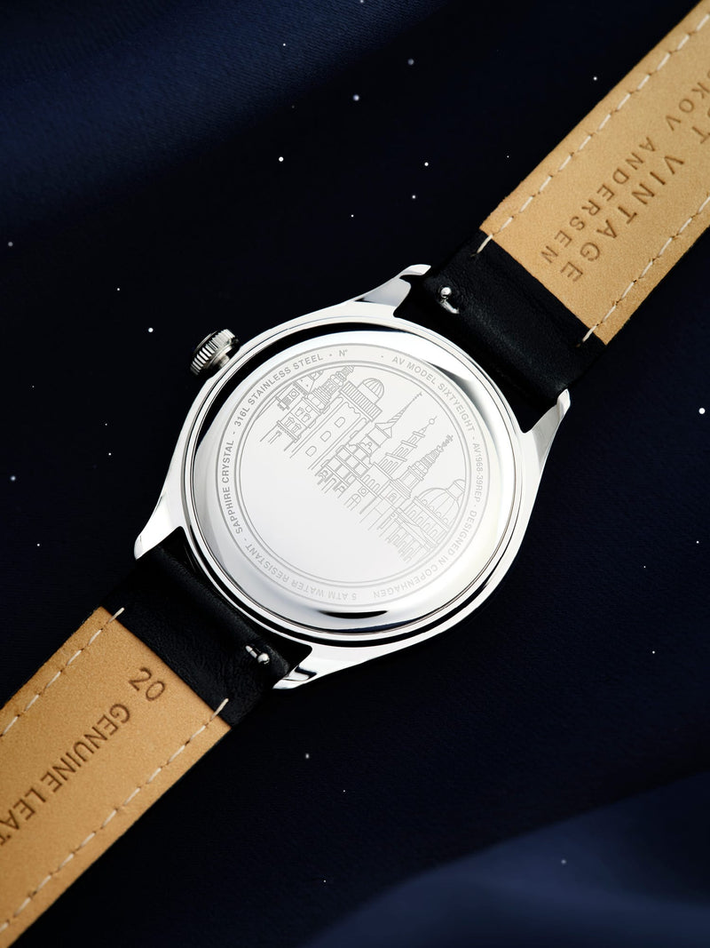1968 Sixtyeight by AV86 showcasing stainless steel case back with engraved cityscape and genuine leather strap detailing