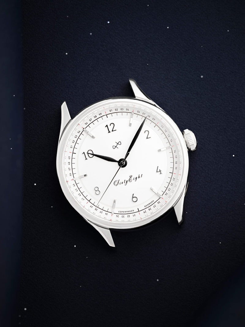 1968 Sixtyeight by AV86 vintage-inspired dress watch with sapphire crystal, minimalist dial, and polished steel case