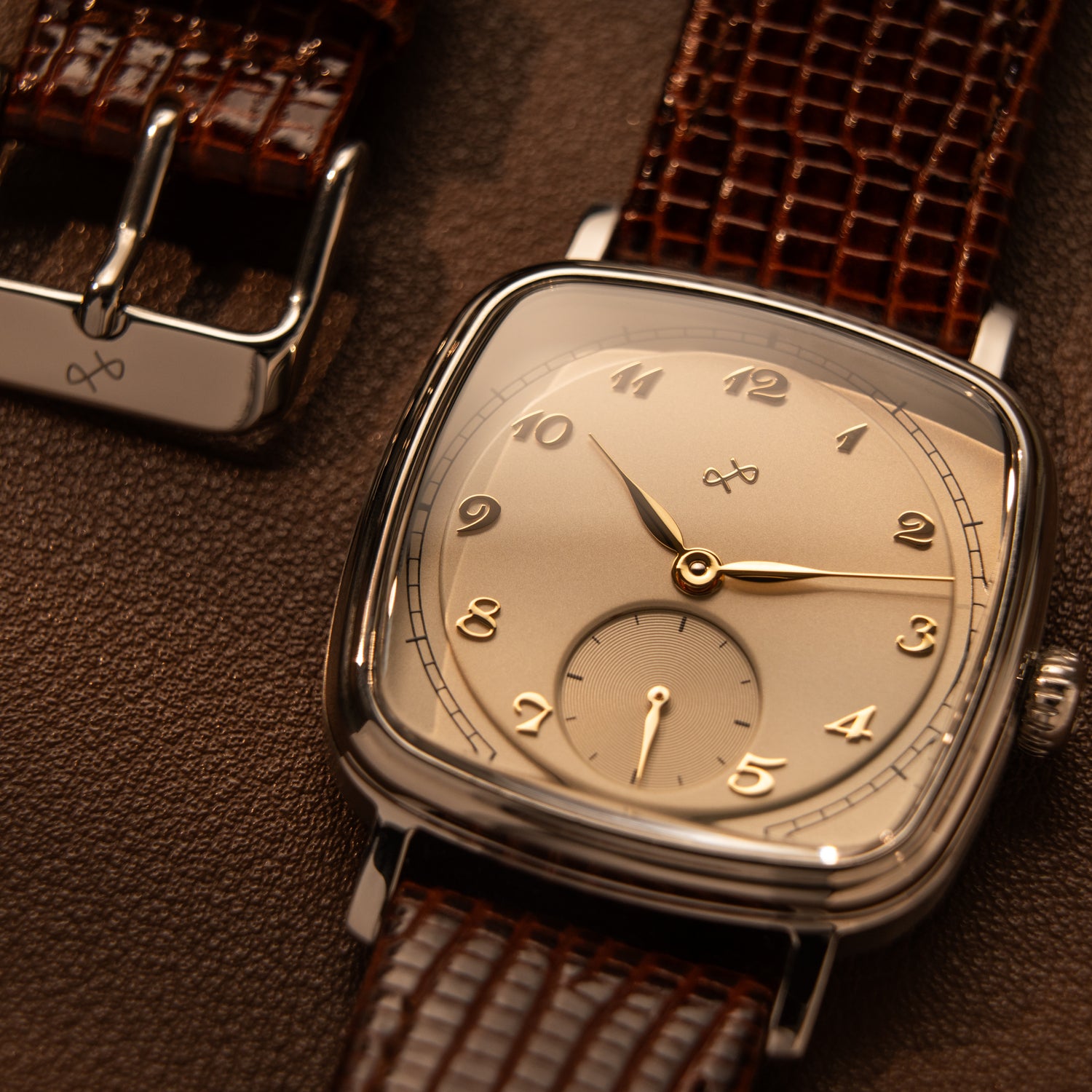 AV86 vintage-inspired dress watch with cushion case, mechanical small seconds, curved sapphire crystal, and textured leather strap close-up.