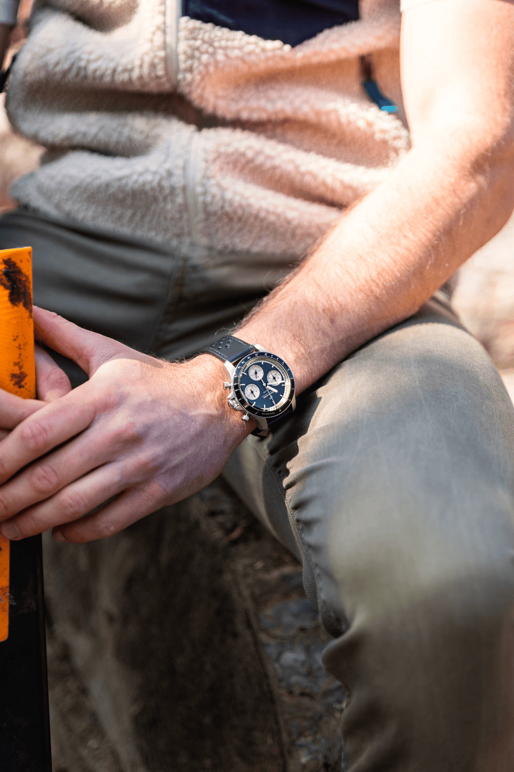 1960 Racing Chronograph by AV86 vintage-inspired chronograph with sapphire crystal and perforated leather strap worn outdoors