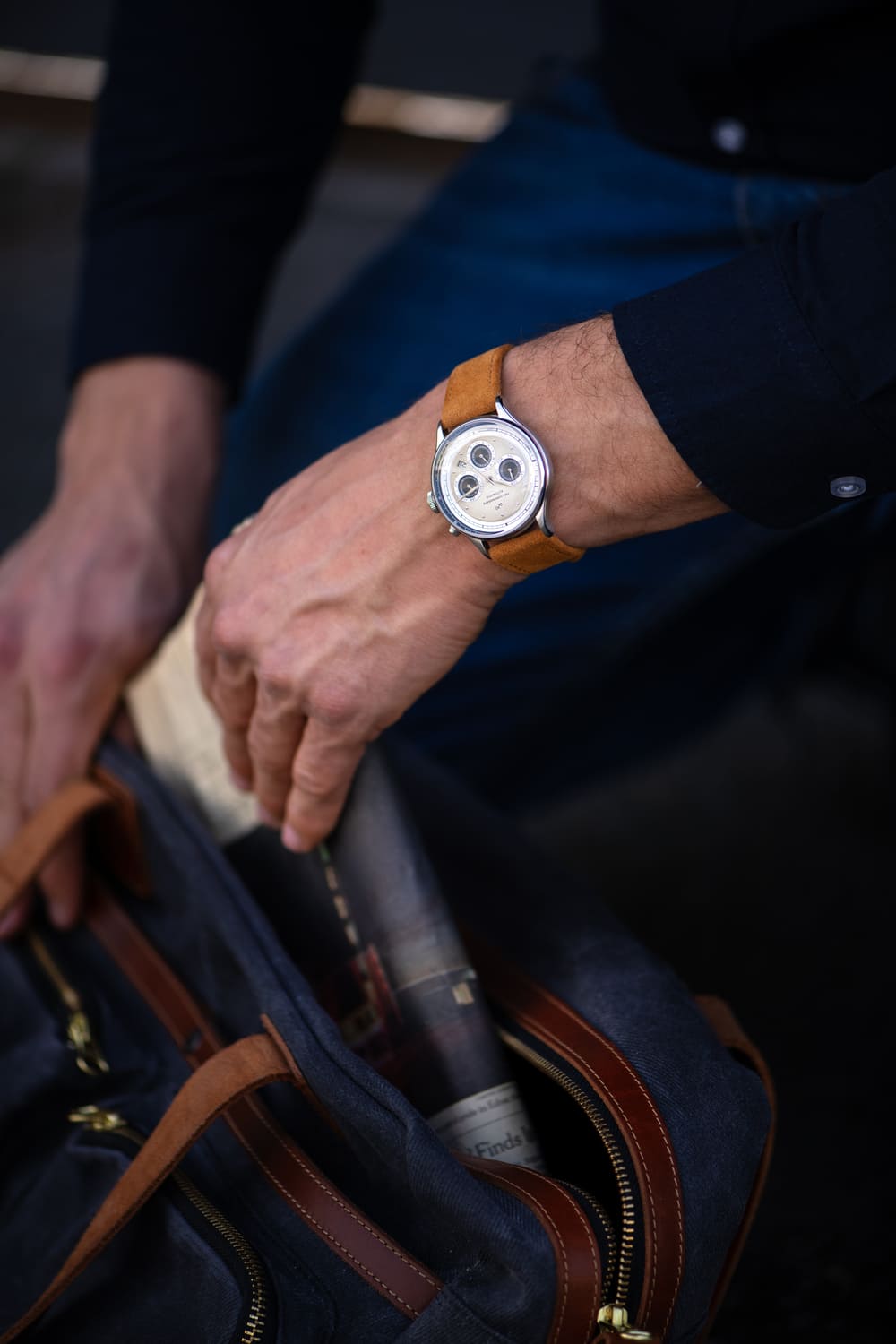 1564 Chronodate Automatic by AV86 wristwatch with vintage chronograph dial, sapphire crystal, and tan leather strap in casual setting