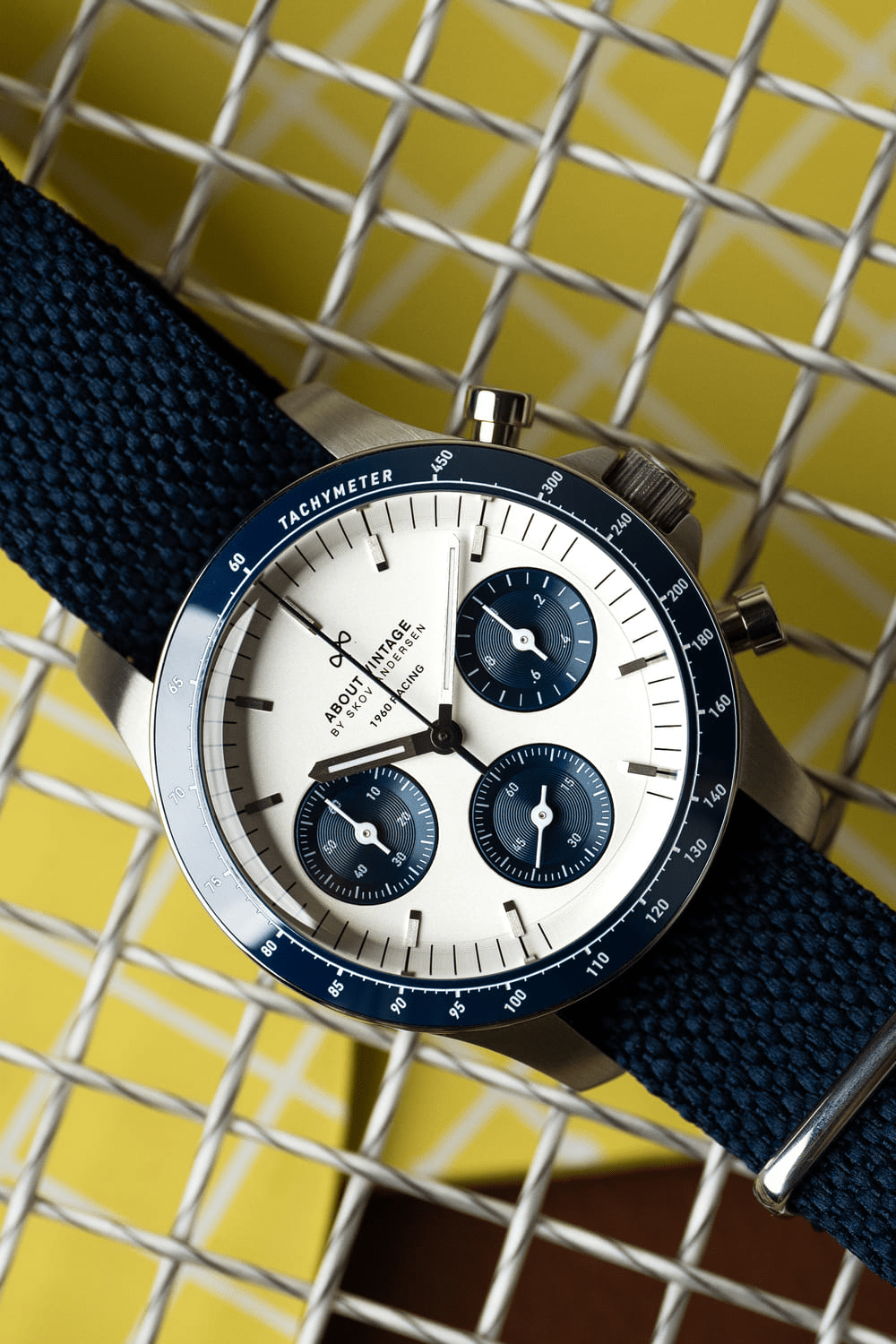 1960 Racing Chronograph by AV86 vintage-inspired with sapphire crystal, tachymeter bezel, and textured navy fabric strap