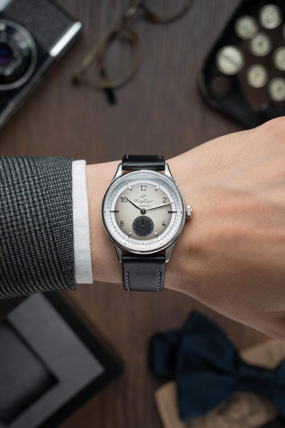 1968 Mechanical (Hand-Wound) by AV86 vintage-inspired dress watch with minimalist dial, sapphire crystal, and black leather strap