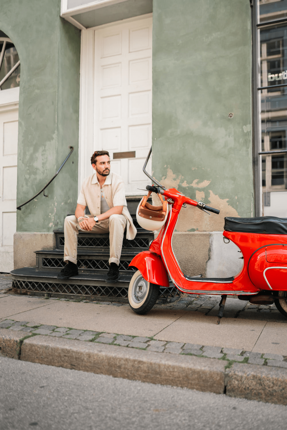 1968 Mechanical by AV86 classic mechanical watch on man seated urban streetwear, vintage European scooter, minimalist vibe