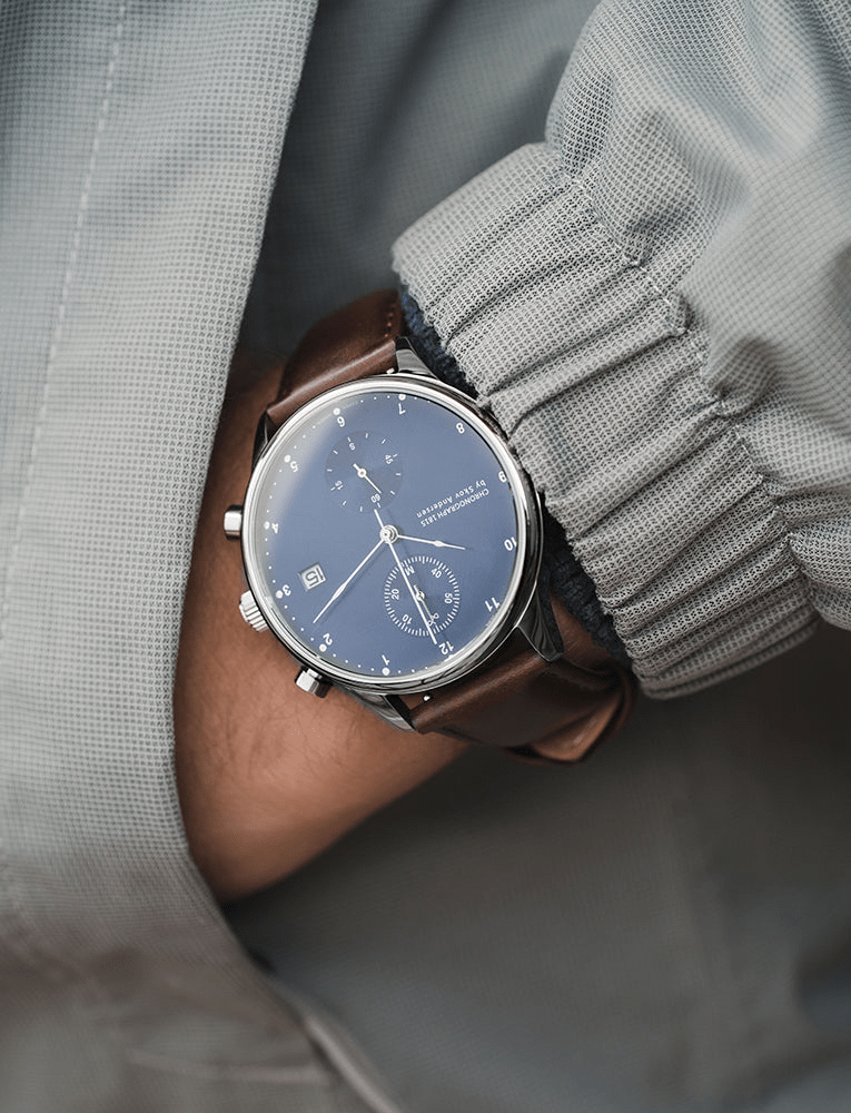 1815 Chronograph by AV86 with sapphire crystal, vintage-inspired dial, chronograph subdials, and brown leather strap on wrist