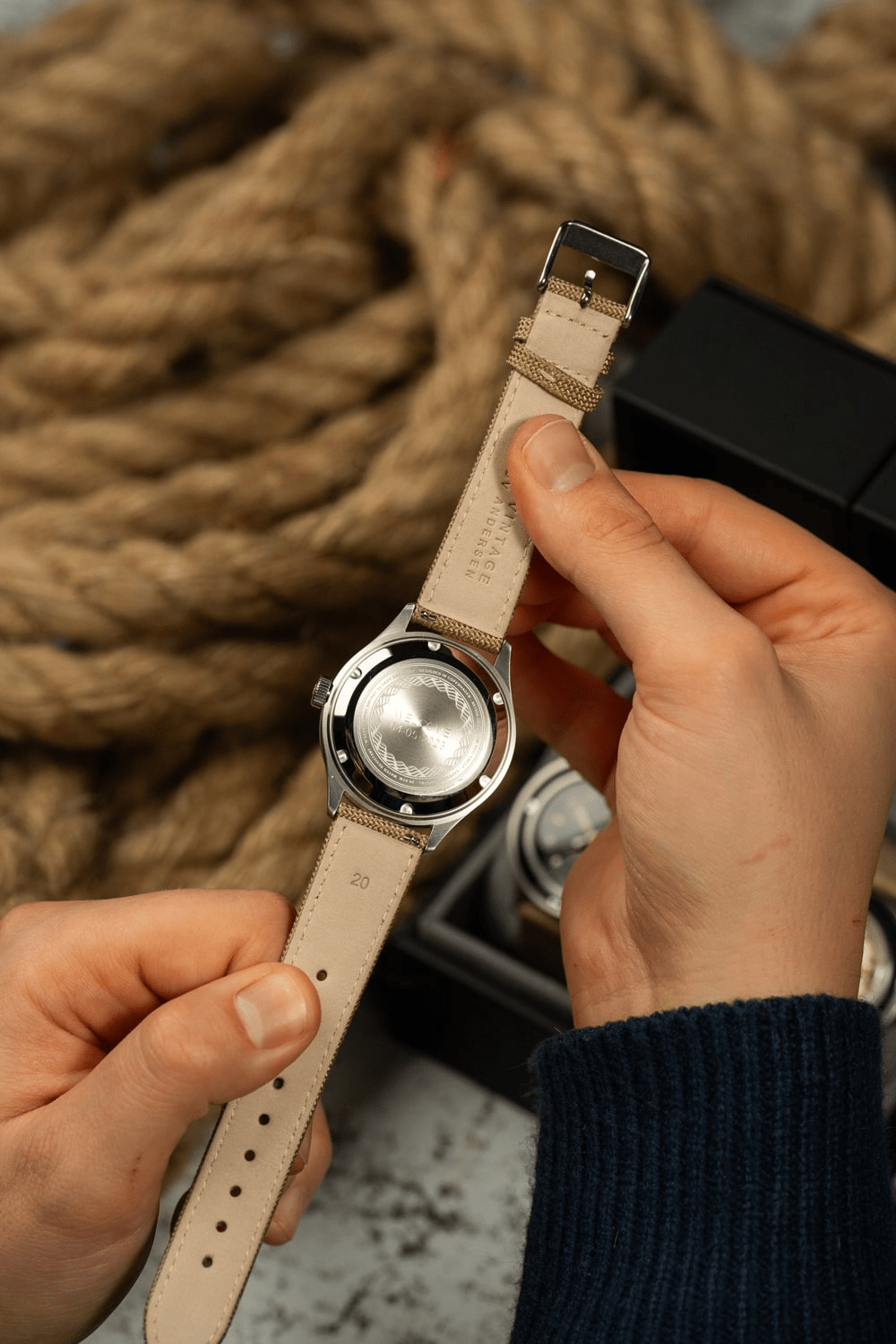 1956 Marine by AV86 showing brushed stainless steel caseback with beige leather strap and vintage-inspired design details