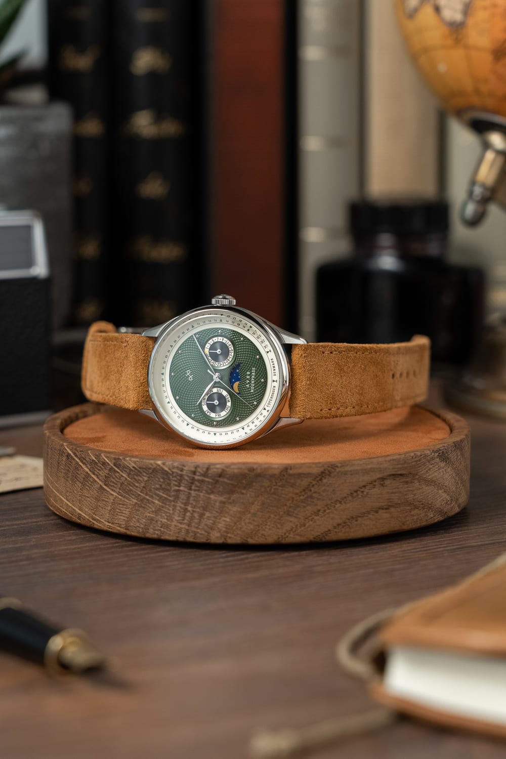 1968 Moonphase by AV86 luxury moonphase watch with sapphire crystal, vintage-inspired dial, and suede leather strap on wooden stand