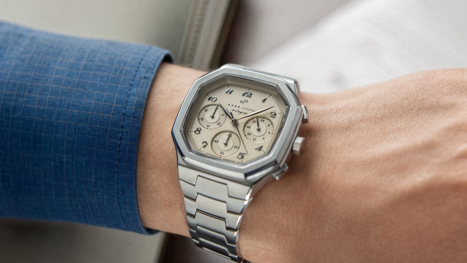 The 1904 Chrono by AV86 features a vintage-inspired chronograph dial with three subdials, encased in a sleek steel case with a brushed finish and a matching metal bracelet, reflecting Danish design and horological excellence in a minimalist luxury timepiece.