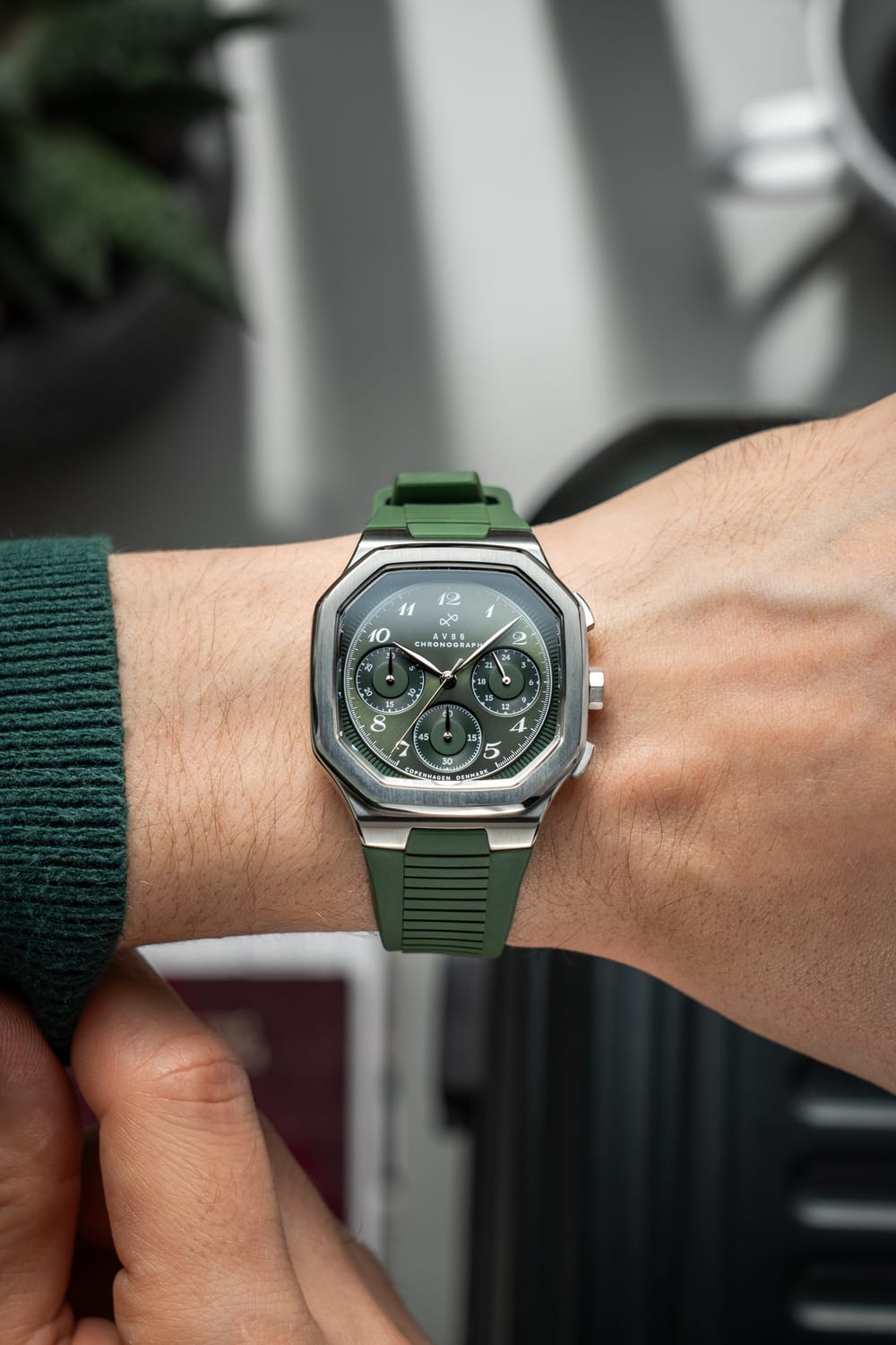 1904 Chronograph by AV86 with angular case, sapphire crystal, green chronograph dial, and green rubber strap reflecting Danish design