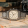 1904 Chrono by AV86, a luxury chronograph with a stainless steel bracelet, off-white dial, sapphire crystal, and vintage-inspired detailing, resting on a map with classic camera background.