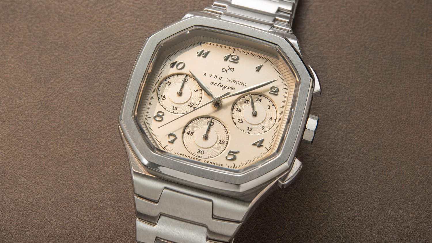 1904 Chrono featuring a polished steel chronograph case, three subdials, sapphire crystal, and integrated metal bracelet by AV86, embodying Nordic minimalism and horological excellence.