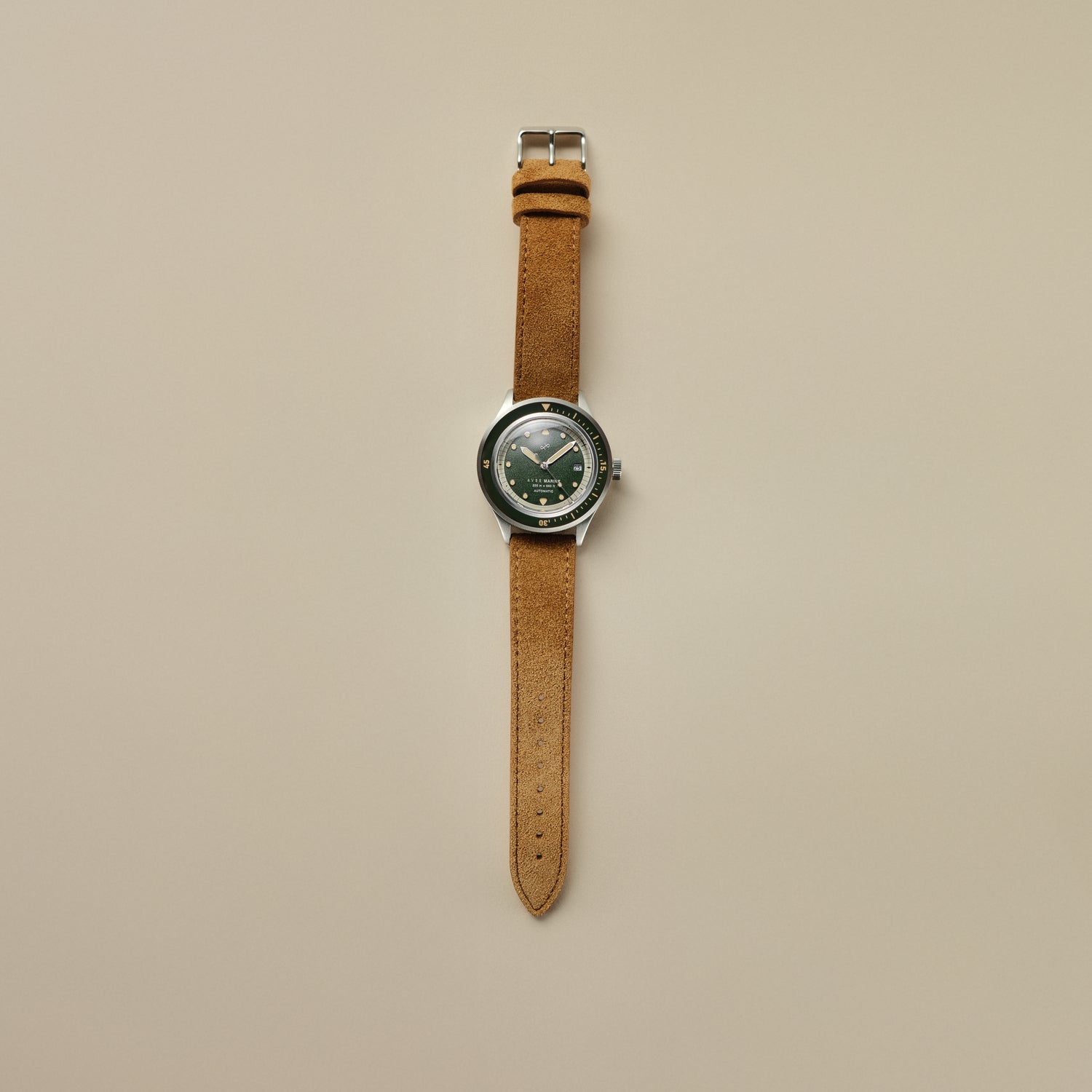 1956 Marine Automatic, Steel / Green by AV86 with green dial and tan leather strap in Danish minimalist vintage-inspired design.