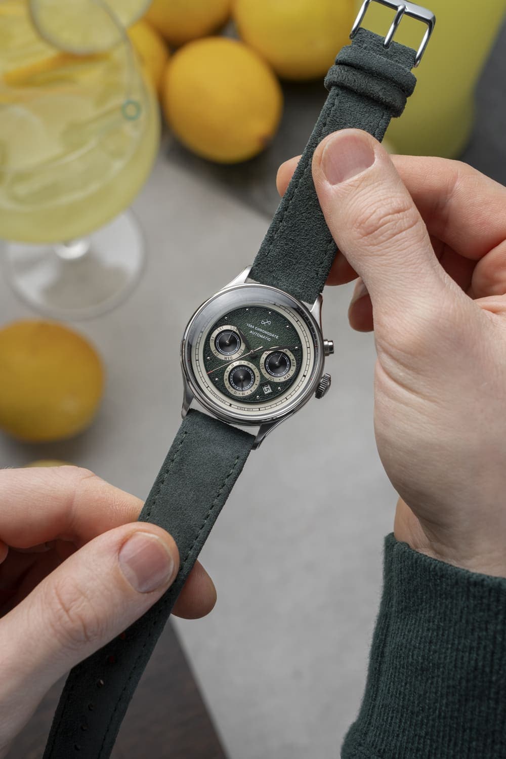 1564 Chronodate Automatic by AV86 vintage-inspired chronograph with sapphire crystal, green dial, and suede leather strap