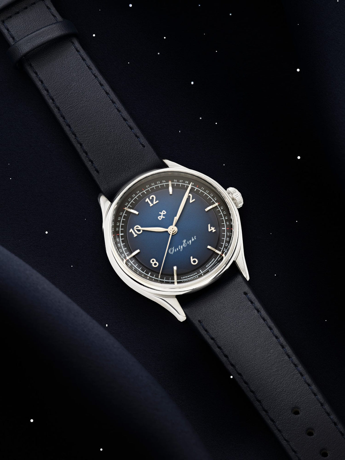 1968 Sixtyeight by AV86 vintage-inspired dress watch with sapphire crystal, blue sunray dial, and black leather strap